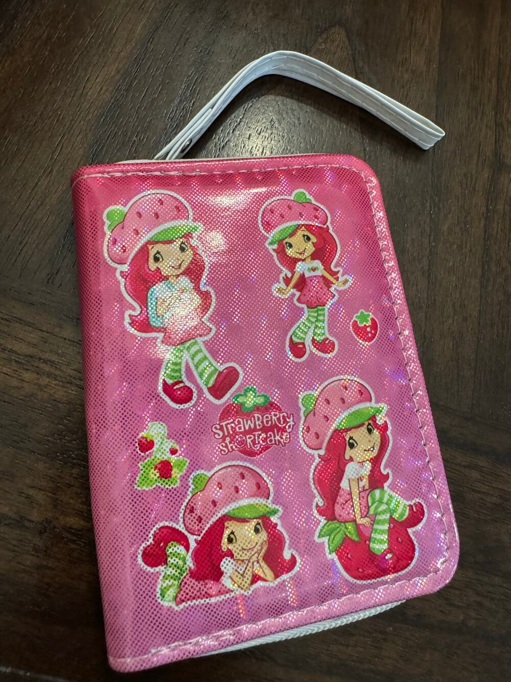 Pink Strawberry Shortcake wallet glittery finish and multiple cartoon characters